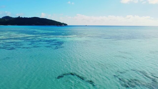 Tranquil Seychelles beach with turquoise ocean view