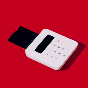 Card reader on red background ready for holiday sales