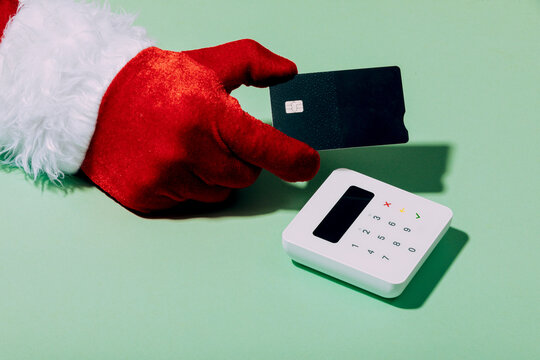 Santa's Red Glove Pays with Card Reader