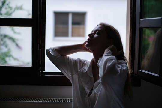 Portrait of woman in silhouette against a window