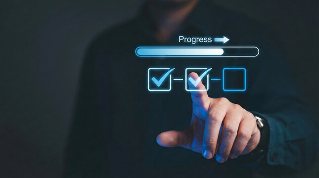 A man's hand touches a digital interface showing a progress bar and checked task boxes, symbolizing project tracking and completion