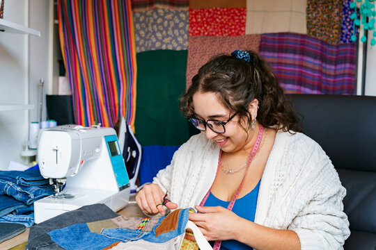 Chilean seamstress working happily at her sewing station