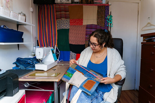 Chilean seamstress working on a colorful textile project
