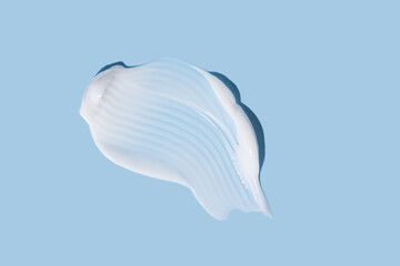 Creamy gel texture with soft wave pattern on blue