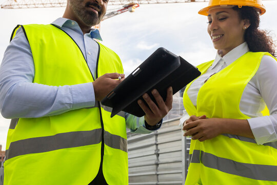 Engineers reviewing plans on site