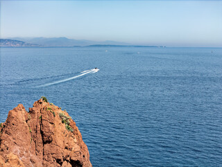 Cliffs on the Cote d'Azur, French Riviera, overlooking Cannes, snow-capped mountains in the background, Drone photo
