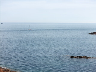 Cliffs on the Cote d'Azur, French Riviera, overlooking Cannes, snow-capped mountains in the background, Drone photo