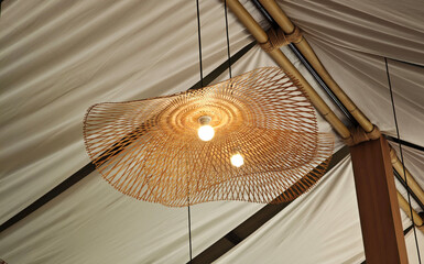 Hanging lamp with a glowing filament bulb