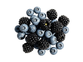 Isolated pile of delicious fresh blackberries and blueberries on a bright, solid surface