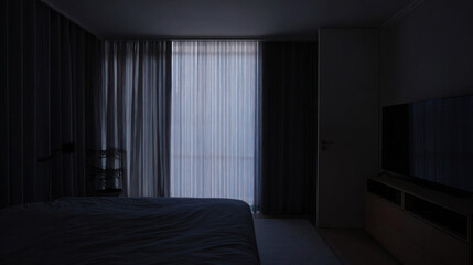 Dimly lit room interior with closed curtains