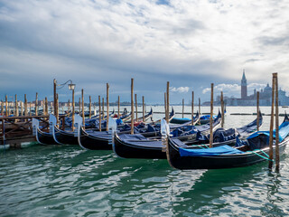 A special atmosphere in the morning. Gondolas in front of the Doge's Palace in Venice.