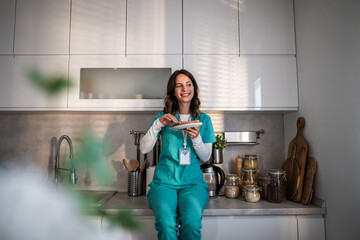 Healthcare worker enjoying a well-deserved break eating breakfast in kitchen