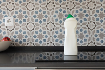 All-Purpose surface cleaner bottle mockup on induction cooktop in modern kitchen