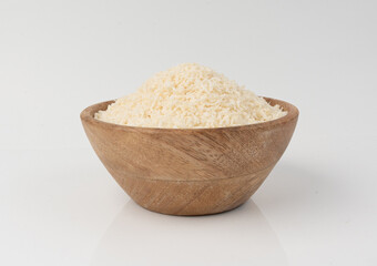 Grated coconut powder. Dry coco flakes pile, shredded desiccated coconut, tropical fruit chips