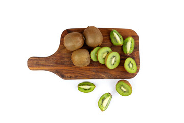 Kiwi fruits slices on wood cutting board
