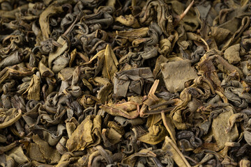 Green tea leaves macro textured background