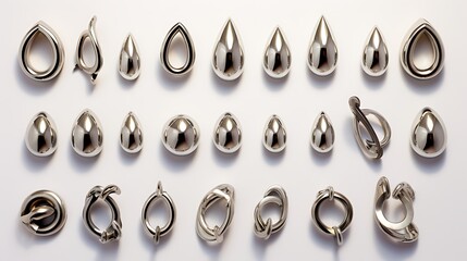 Various silver jewelry findings and components on white background