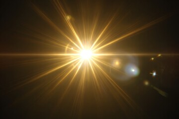 Fototapeta premium Vibrant golden light burst on dark background with lens flares