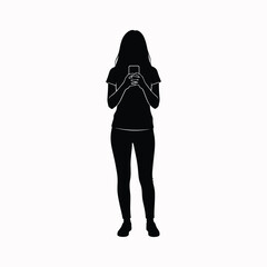 Woman silhouette using mobile phone while standing
