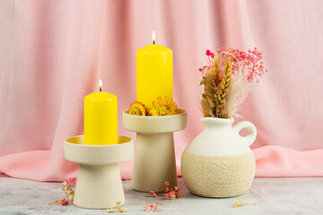 Candles and vase with plants