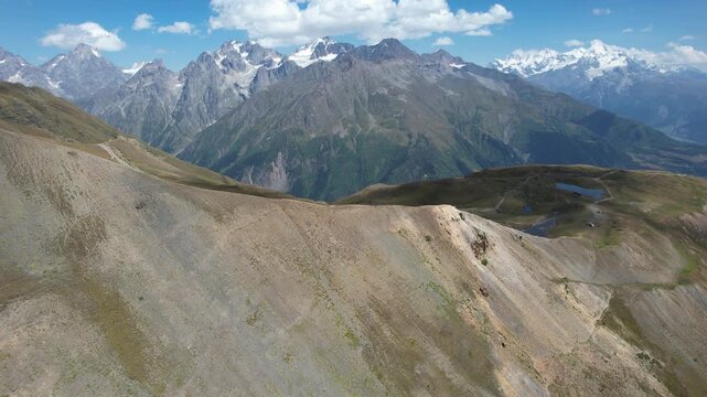 Aerial drone view of the Koruldi Lakes in the Svaneti region of Georgia, with the Caucasus mountains in the background