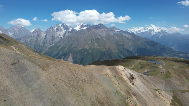 Aerial drone view of the Koruldi Lakes in the Svaneti region of Georgia, with the Caucasus mountains in the background