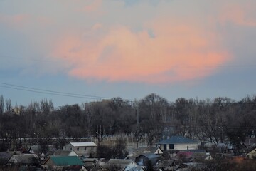 Modern building in the city at sunset, closeup of photo in a winter season