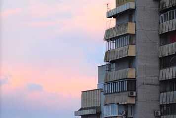 Modern building in the city at sunset, closeup of photo in a winter season