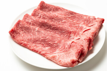 Fototapeta premium 皿に乗った牛肉 白バック