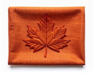 Embroidered Maple Leaf on Rectangular Orange Fabric Isolated on White Backdrop