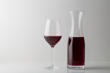 Red wine glass and bootle with shadow on withe background