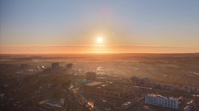 Atmospheric Sunrise Cityscape With Fog and Chimney Steam. Basingstoke. UK