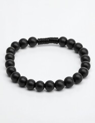Obraz premium Elegant Black Bead Bracelet Isolated on White Background Studio Shot