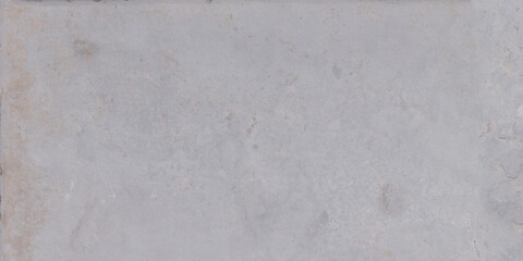 Fototapeta premium The rough surface of a stone slab with a concrete hue. Design for porcelain tiles
