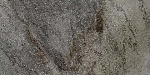 The rough surface of a stone slab with a concrete hue. Design for porcelain tiles