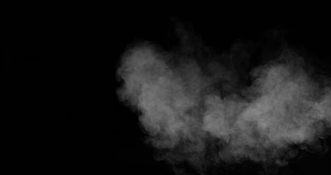 Super slow motion smoke effect of visible breath exhalation in icy conditions, filmed at 500 fps on a high-speed camera. Isolated on black background, ideal as realistic VFX overlay.