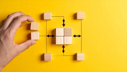 Business process management flowchart with wooden blocks and black arrows representing organizational structure planning and logical steps