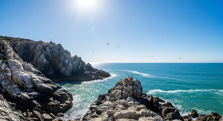 Scenic rocky coastline ocean waves crashing on shore sunny day blue sky and clear water landscape photography