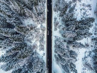 Winter magic in the Julian Alps. Lake Predil seen from above. Between snow and ice.