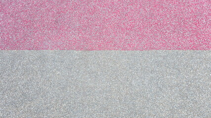 Fototapeta premium Rubber floor mats or fitness rubber floors in Red and gray, Red (top) 1 part, Gray (bottom) 2 parts.. Rough surface, uneven color. Sports fields, fitness, playground, EPDM rubber floors, synthetic, 