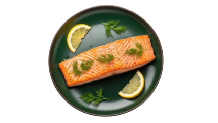 Isolated tasty cooked salmon with fresh herbs and lemon wedges served on a plate