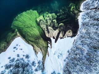 Winter magic in the Julian Alps. Lake Predil seen from above. Between snow and ice.