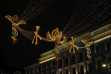 Ornate Golden Decorations Illuminating a City Street at Night