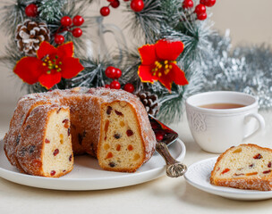 Freshly baked Kuglof, kougelhopf, Alsatian brioche with raisins, candied fruits, orange peel and almonds. Christmas mood. Easter.