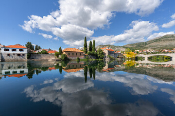 Obraz premium Historical town of Trebinje with reflections in the river Trebisnjica in Bosnia and Herzegovina