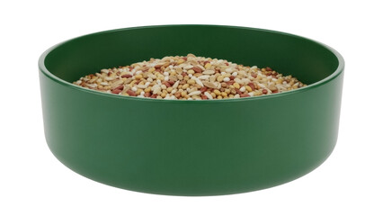 Isolated full green bowl of assorted small seeds, a good diet for pets such as small birds