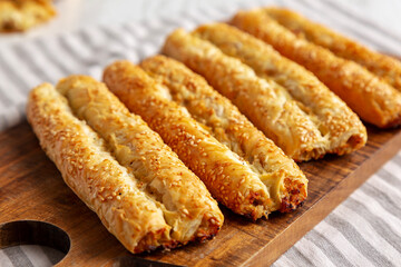 Homemade Rollini with Chicken on a Wooden Board, side view. Close-up.