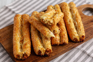 Homemade Rollini with Chicken on a Wooden Board, side view.