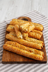 Homemade Rollini with Chicken on a Wooden Board, side view.