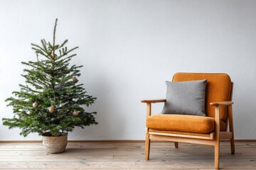Evergreen holiday tree stands beside a vintage style armchair with cushion in a minimalist room